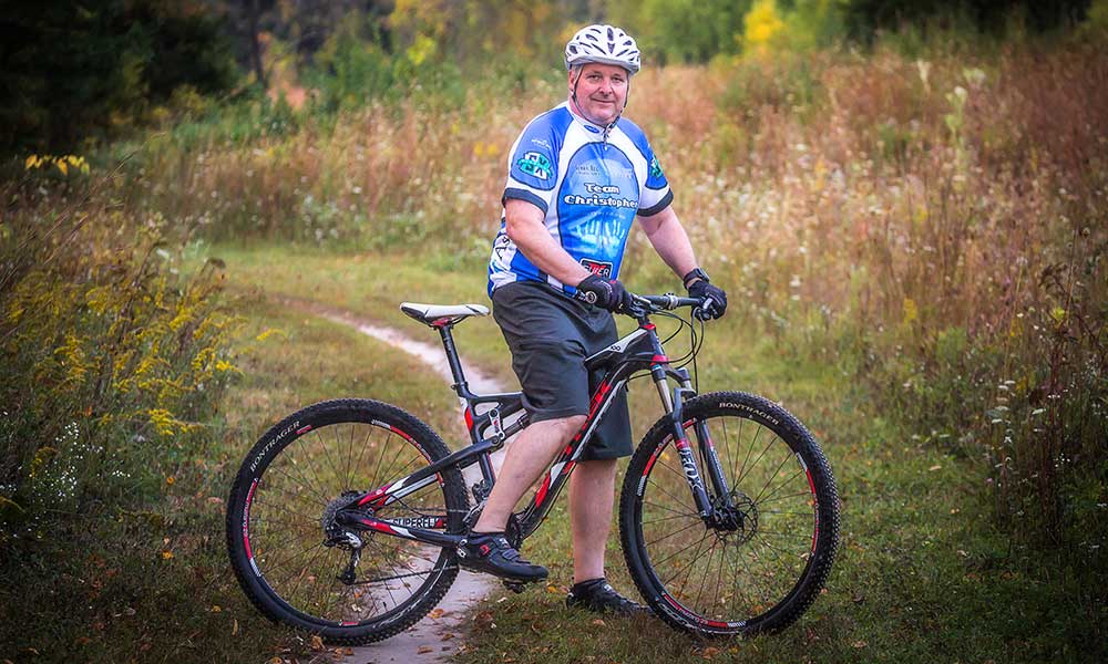 Jim Siepman posing on a mountain bike