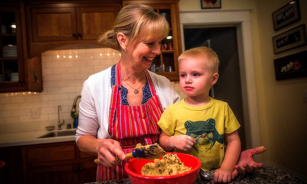 Karen Siepmann baking cookies with grandson